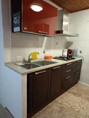 a kitchen with a sink and a stove at La Rosa Dei Venti in Castellammare del Golfo
