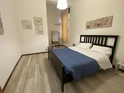 a kitchen with a table and a stove top oven at Sampolo70 - Apartments in Palermo