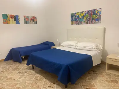 a paper with a flower pattern on a table at Sampolo70 - Apartments in Palermo