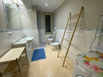 a hallway with three paintings on a wall at Sampolo70 - Apartments in Palermo