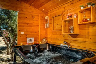 a kitchen with a sink in a wooden house at Palma Dello Zingaro in Scopello
