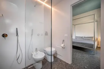 a living room with a couch and a table at BED 10.5 - DESIGN SUITE in Castellammare del Golfo