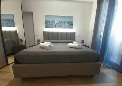 two rolled towels on a bed in a hotel room at Les Voiles in Terrasini