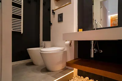a bathroom with a toilet and a sink at Politeama Centre in Palermo