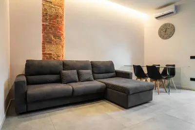 a living room with a couch and a table at Politeama Centre in Palermo