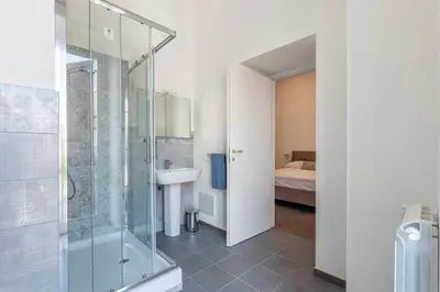 a bathroom with a shower and a sink at Apartments La Cala by Wonderful Italy in Palermo