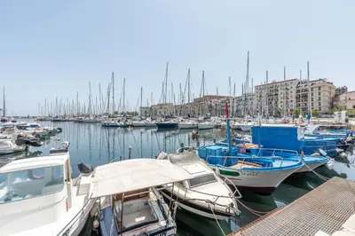 a bunch of boats are docked in a harbor at Apartments La Cala by Wonderful Italy in Palermo