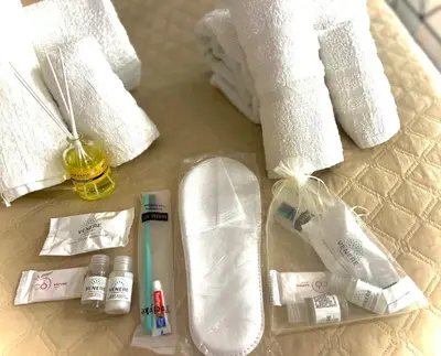 a bathroom with towels and a sink and some toiletries at A casa di ilary in Palermo