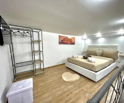 a bedroom with a bed and a ladder at A casa di ilary in Palermo