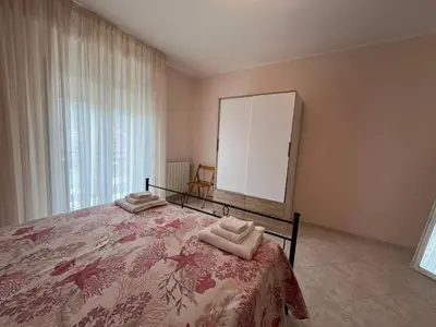 a bedroom with a bed with two towels on it at Appartamento Gemma D'oro in Castellammare del Golfo
