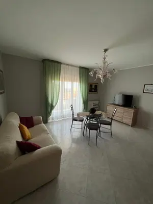 a living room with a couch and a table at Appartamento Gemma D'oro in Castellammare del Golfo