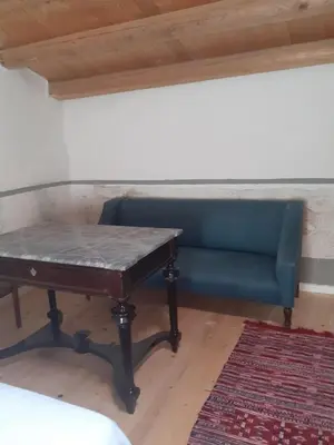 a table and a blue bench in a room at Domus 31 in Palermo