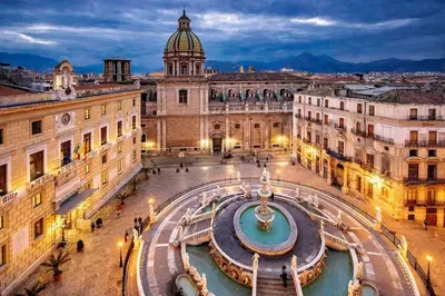 a view of a city with a fountain in the middle at Giardino Segreto Luxury Home in Palermo