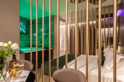 a room with a crib with a bed in it at Aquasuite - Luxury Experience & Spa in Palermo