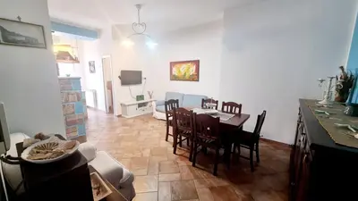 a kitchen and dining room with a table and chairs at A Casa di Sasy in Palermo