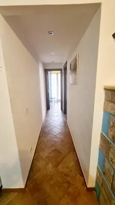 a hallway with white walls and a tile floor at A Casa di Sasy in Palermo
