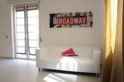 a bedroom with a bed with red roses on it at Case Playa in Balestrate