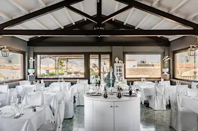 a dining room with white tables and white chairs at Eurostars Centrale Palace Hotel in Palermo