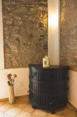 a room with a barrel with a tea pot on top at Masseria Baglio Perciata in Camporeale