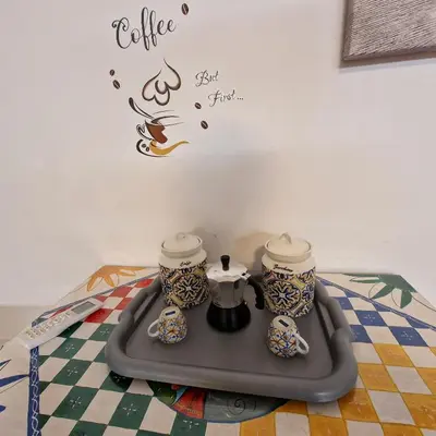 a tray with two coffee pots on top of a table at Aspettando Vossia in Palermo