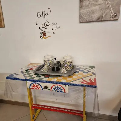 a table with a tea set on top of it at Aspettando Vossia in Palermo