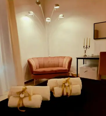 a living room with towels and a couch at Affittacamere Ammirata in Palermo