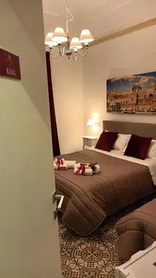a bedroom with two beds in a room at Affittacamere Ammirata in Palermo