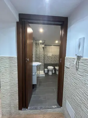 a bathroom with a toilet and a sink and a mirror at Casa da Francesca in Palermo