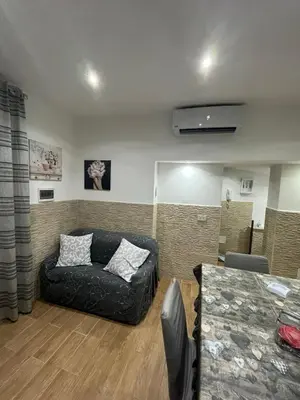 a living room with a couch and a table at Casa da Francesca in Palermo