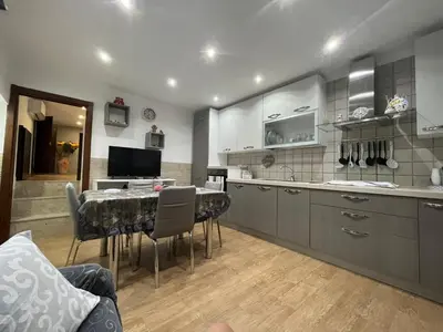 a kitchen with a table and a dining room at Casa da Francesca in Palermo