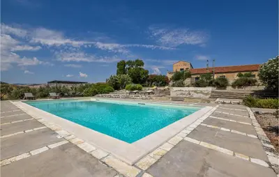 a swimming pool in the middle of a yard at Acque Di Palermo in Roccapalumba