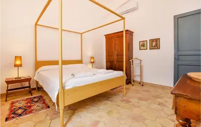 a bedroom with a canopy bed in a room at Acque Di Palermo in Roccapalumba