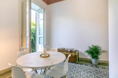 a dining room with a table and chairs at GuestHost - Teatro Massimo Bright and Cozy Apartment in Palermo