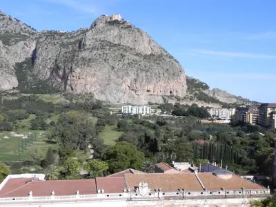a view of a mountain with a city and buildings at Torreata Hotel & Residence in Palermo