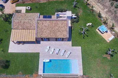 an aerial view of a house with a swimming pool at VILLA DEL BORGO con piscina e jacuzzi in Scopello
