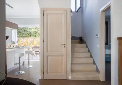 a door leading up to a staircase in a house at Seaside Villa in Carini