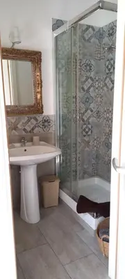 a bathroom with a sink and a shower at Loft Ballarò in Palermo