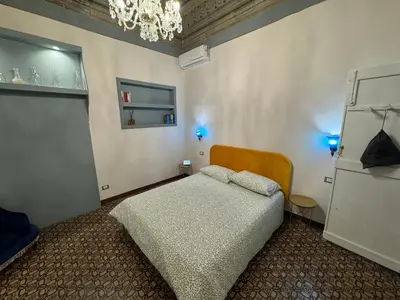 a bedroom with a bed in a room at Belvedere Suite in Termini Imerese