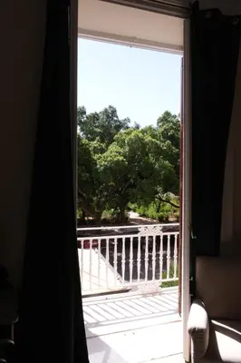 a window with a view of a balcony at Belvedere Suite in Termini Imerese