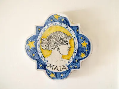 a plate with a woman with stars on it at Le Plejadi in Castellammare del Golfo
