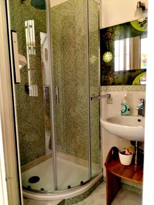 a bathroom with a shower and a sink at Casa Sedie Volanti in Palermo