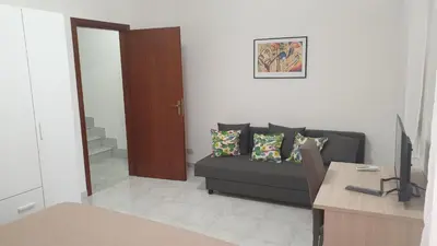 a living room with a couch and a table at Casa Vacanze San Martino in Corleone
