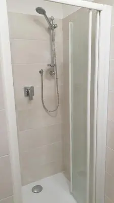 a shower with a shower head in a bathroom at Casa Vacanze San Martino in Corleone