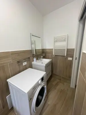 a laundry room with a washing machine and a sink at Casa Himera Palermo in Palermo