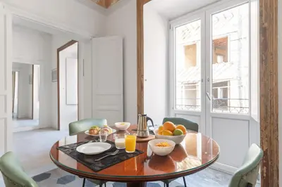 a dining room with a table with fruit on it at 124 Maqueda Apartments in Palermo