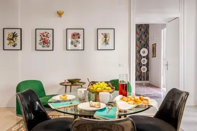 a dining room with a table with fruit on it at 124 Maqueda Apartments in Palermo