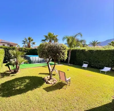 a yard with two chairs and a tennis court at Villa Jari in Carini