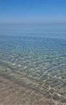 a large body of water with rocks in it at Villa Jari in Carini