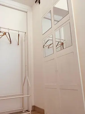 a pivot door in a room with white walls at Casa Lella Holiday Boutique in Palermo