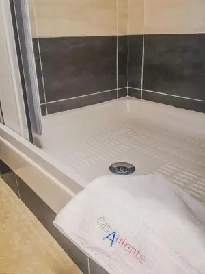a bathtub with a white towel sitting in it at Casaulente in Alcamo